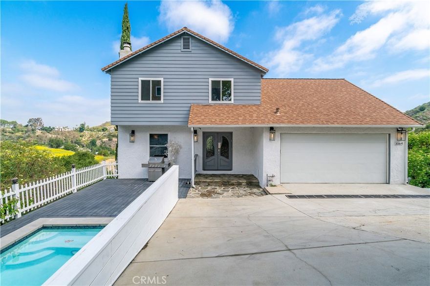Incredible Opportunity in Calabasas Highlands



Nestled in one of the most exclusive areas of Calabasas, this charming 3-bedroom, 3-bathroom home offers breathtaking panoramic canyon views and an unbeatable location at the end of a quiet cul-de-sac. With no HOA and endless potential, this property is perfect for those who love to entertain, relax in privacy, or take in the beauty of the outdoors.



The inviting living room features a cozy stone fireplace and beautiful hardwood floors, while the spacious kitchen is equipped with modern appliances and opens up to a balcony with stunning views. The family room flows seamlessly into the attached dining area, creating the ideal space for gatherings.



All three bedrooms are located upstairs, with the primary suite offering its own private balcony where you can enjoy the sweeping views. Outside, the pool/jacuzzi and outdoor lounge area is perfect for unwinding and entertaining guests.



Additional highlights include an attached 2-car garage with direct access and a extended driveway, providing easy turnaround access. There’s also bonus space beneath the main floor in the basement, which offers the potential to be converted into an ADU or additional living area. Already the electrical and plumbing seem to be completed in the expansion area. Located in the highly sought-after Las Virgenes School District, this home offers a rare opportunity to live in a coveted area at an exceptional value.



Ready to move in and start living your Calabasas dream!