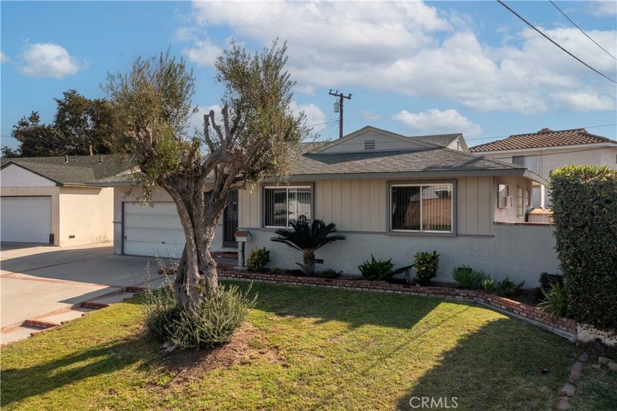 Welcome to this charming La Mirada home. Step inside this spacious 3-bedroom, 1.5 bath layout featuring a cozy step-down family room with beautiful exposed wood ceilings and an abundance of natural light overlooking the backyard.  The kitchen opens to the dining area and family room, creating a comfortable flow for everyday living and entertaining. A convenient laundry room and half bath are located near the rear entry for added functionality.  

Each bedroom offers great closet space, and the primary suite includes a built-in cabinet providing generous storage. The backyard offers plenty of room to relax, play, or even add a pool, a wonderful opportunity to create your own outdoor retreat.  In the garage there is a extra room that can be used as a office or storage.