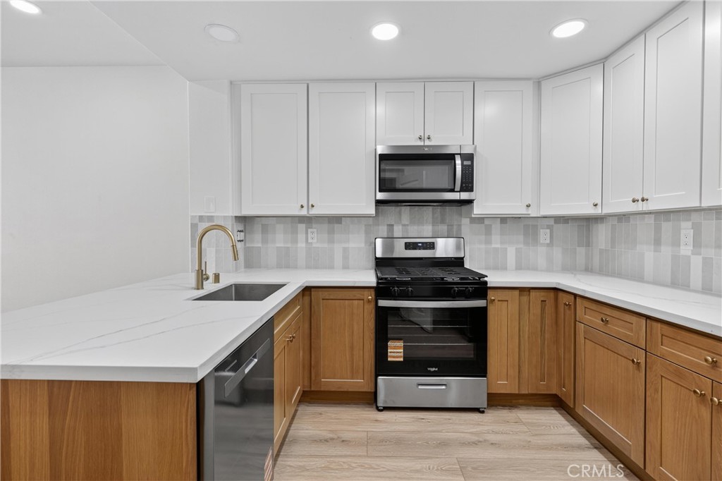 BOTTOM SINGLE STORY UNIT, new kitchen, new kitchen appliances, new flooring, new interior paint, new bathroom.