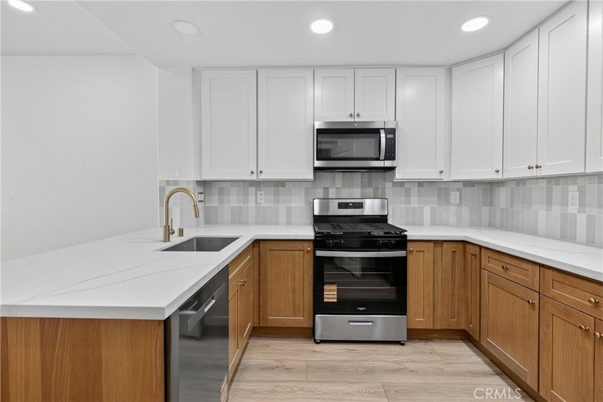 BOTTOM SINGLE STORY UNIT, new kitchen, new kitchen appliances, new flooring, new interior paint, new bathroom.