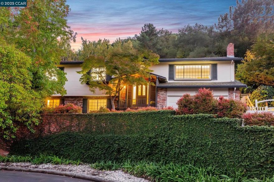 Tucked away on a peaceful cul-de-sac in one of Lafayette’s most desirable neighborhoods, this inviting home combines generous living space with a warm, welcoming feel. Set on a beautifully landscaped 1.17-acre lot, watered by a year-round spring, this property offers a serene sense of privacy.  The light-filled main level features three comfortable bedrooms and two full baths. A spacious great room with soaring ceilings connects seamlessly to the formal living and dining areas, each anchored by a cozy fireplace—perfect for gatherings or quiet evenings at home. The bright eat-in kitchen includes stainless steel appliances and opens to views of the expansive backyard, where endless possibilities for play, gardening, and outdoor entertaining await.  Downstairs, a private ensuite bedroom and Living room provide an ideal retreat for guests, extended family, or a home office. With its two-car garage, thoughtful layout, and tranquil setting, this exceptional Lafayette home embodies the perfect blend of comfort, space, and timeless charm.  The gorgeous hardwood floors have been refinished and the home has been painted inside and out so you can move right in!  OPEN HOUSE Sunday, Nov 2,  1:-00 - 4:00