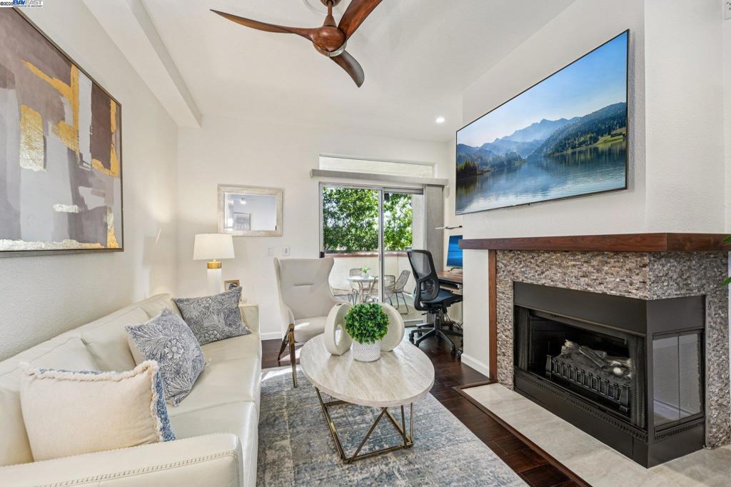 Private and serene, this Mediterranean-style beauty blends comfort with modern flair. Enjoy stunning skyline sunset views from your spacious outdoor patio—perfect for relaxing or entertaining. This desirable lower-level, corner end-unit features wood floors throughout, an open living area, and a beautifully updated kitchen with granite countertops, new cabinetry, and stainless steel appliances. The primary suite boasts a generous walk-in closet, and the convenience of in-unit laundry adds to the ease of everyday living. Includes a dedicated covered end parking stall directly in front of the unit, plus ample guest parking. Prime location within the complex and close proximity to BART, 580/680 freeways, shopping, dining, and local activities. HOA amenities include a clubhouse, BBQ area, volleyball court, and two sparkling swimming pools. A true 10+—don’t miss this opportunity to live in a vibrant and welcoming community! Open house 1 to 4 pm SAT & SUN