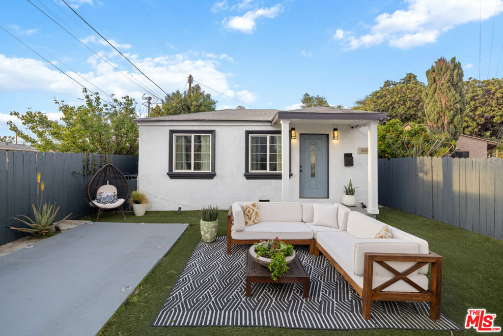 Welcome to 6523 Scout Ave - A thoughtfully upgraded property that delivers form, function, and lifestyle in one curated package. Just steps from Hannon Park, this stylish DUPLEX redefines compact living with two separate dwellings, each offering its own unique charm and livability. The front residences beautifully reimagined 1-bedroom, 1-bath home will be delivered VACANT and is MOVE-IN ready. Ideal for first-time buyers seeking a townhouse alternative without the HOA fees, this space offers the privacy of a detached home with all the modern comforts you've been searching for. Clean architectural lines and a warm, modern aesthetic set the tone, while an open-concept layout with recessed lighting and abundant natural light creates an inviting, airy space. The kitchen is a showcase of smart design complete with quartz countertops, a classic tile backsplash, a farmer-style sink, and a butcher block island with bar seating. A sliding barn door discreetly conceals the washer/dryer hookups, preserving a clean, modern flow. The bathroom mirrors this intentionality with contemporary finishes and efficient use of space. Every square inch has been crafted for ease and livability. Outside, curated landscaping and designer staging extend the living experience: a modern horizontal wood fence, turf grass, recessed landscape lighting, and ambient string lights create a private, relaxed atmosphere perfect for cozy evenings and entertaining. The rear unit is a non-conforming structure that will not be delivered vacant, and was in place when the current owner acquired the property.