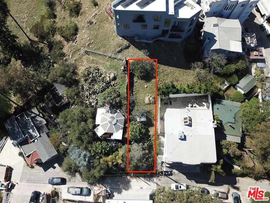 Don't miss this incredible opportunity to own land in the prestigious Hollywood Hills. This upslope lot, approximately 2,500 square feet and zoned LAR1, offers breathtaking canyon and city views from a peaceful cul-de-sac street. All utilities, including water, power, gas, and sewer, are conveniently available at the street. There is a small white shed on the lot which will be included in the sale. Ideally situated in a highly sought-after neighborhood surrounded by multi-million-dollar homes, this prime location provides easy access to the 101 Freeway, the Hollywood Bowl, and the best shopping, dining, and entertainment Los Angeles has to offer. SELLER IS OPEN TO FINANCING.