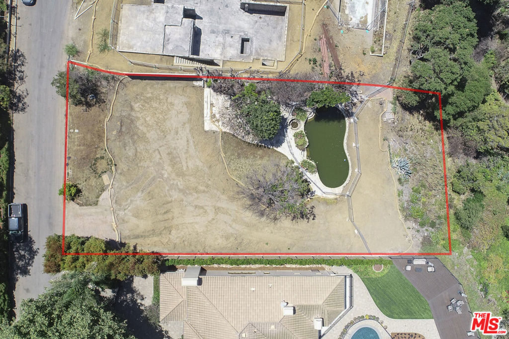 Incredible opportunity to design and build your desired home in the prestigious and highly coveted Riviera Palisades, just a few minutes from the Riviera Country Club, the home of the Genesis Golf Open; property is in a tranquil and private 11-home cul-de-sac with magnificent views of Will Rogers State Park, Polo fields, mountains, parital Ocean View from the backyard deck with fabulous Ocean Breezes, and no traffic noise from Sunset. Stringent State regulations prevent building homes or structures across the canyon from this property. The property is 0.2822 acres (12,288 sq ft), inspected and cleared by the EPA and FEMA, and fenced by the Army Corps of Engineers. Homes that burned were limited to five homes on the south side of the cul-de-sac. Homes across the street sustained no structural damage. All utilities are available immediately, need a hookup, and are ready to turn on. No HOA, and this is one of the EXTREMELY RARE residential properties in the entire Riviera Palisades that is NOT a member of any of the three HOAs that blanket the Riviera Palisades, so no approval requirement for new design or building from the HOA.