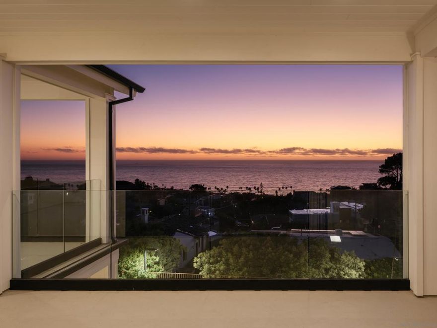 Perched above the Pacific in the coveted enclave of Sunset Cliffs in Point Loma, San Diego, this custom home captures the essence of California coastal living with unobstructed, panoramic ocean views where the expansive blue sea captivates you by day and mesmerizing sunsets invite a night sky engulfed in stars. Thoughtfully reimagined, the home blends timeless character with modern sophistication—where layered textures, earthy tones, and custom craftsmanship create a warm yet refined aesthetic. Inside, a chef’s Wolf stove, solid white oak floors, Hermitage stone, and a bespoke fireplace anchor the living spaces. Every ensuite bedroom provides comfort and function, while the upstairs primary suite engulfs you in luxury with custom cabinetry, walk-in closet, spa tub, a Mr. Steam oversized shower, and retractable glass walls that seamlessly blend interior and exterior. Private guest quarters over the garage make hosting guests or family effortless. Engineered for both elegance and resilience against the elements, the home offers a reinforced foundation, Hardy board siding, new water and electric systems, and a 1.5” water meter for future expansion. Enjoy the year-round lifestyle with EVOO + Lynx BBQ kitchen, Milgard doors, epoxy garage, a sport court with stadium lighting, plus a second level landing designed to convert into an infinity lap pool. From the glass railings that frame endless sunsets to every thoughtfully curated finish, this is more than a home. It’s a coastal retreat built for living, entertaining, and evolving, in one of San Diego’s most iconic communities!