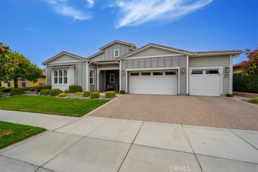 Experience elevated living in this stunning Marsanne Plan, perfectly sited on a premium lot with uninterrupted panoramic views of the lush vineyards and Challenge golf course. Built in 2018, this elegant 3,112 sq. ft. residence blends timeless sophistication with modern design for an unparalleled lifestyle in Trilogy at Monarch Dunes.
Step inside and be captivated by expansive open-concept living spaces enhanced by soaring ceilings, designer finishes, and walls of glass framing the spectacular scenery. The gourmet kitchen is a chef’s dream, showcasing GE Monogram appliances, including a built-in refrigerator, 6-burner gas range, double ovens, and a spacious walk-in pantry. The oversized quartz island invites gatherings, while adjacent dining and lounge areas create seamless flow for entertaining.
Retreat to the luxurious owner’s suite, where breathtaking views greet you each morning. Indulge in a spa-inspired bath featuring a deep soaking tub, walk-in shower with frameless glass, dual vanities, and a generous walk-in closet. The thoughtful layout includes guest suites with private baths, an elegant powder room, and a versatile den or home office.
Outside, enjoy the ultimate California lifestyle with professionally designed outdoor spaces, expansive patios, and endless vistas. Additional features include premium flooring, custom window treatments, and a three-car garage.
All of this is complemented by resort-style amenities of Trilogy: championship golf, fine dining, a luxury spa, state-of-the-art fitness, and endless social opportunities. This is more than a home—it’s a destination.