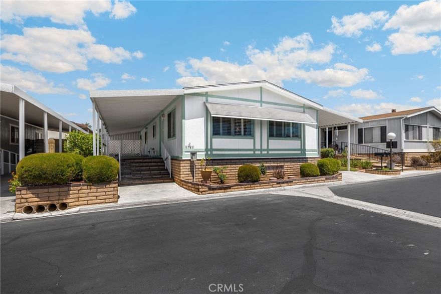 Motivated Seller - HUGE Price Reduction! **Great Location in Lake Park Brea - 2 BR and 2 Baths - Freshly painted throughout - Plantation Shutters - Updated Kitchen - Large Living Room has vaulted ceilings, an electric fireplace, and Great neighborhood views! - The roomy Dining Room has a large Built-in Hutch - The Main suite has a private bath with soaking tub and separate shower - The Guest Bedroom has direct access to the second/Guest bath which also has a tub/shower combination - There's a nice Laundry room with the Washer and Dryer included - The fully covered patio is elevated to make using it more enjoyable - There's even a lower patio for more privacy or a place for the grandchildren to play - The Patio area is roomy enough for a Barbecue with Friends or a small garden for those who wish to grow their own fruits and vegetables - The Carport is large enough for 2 cars or even a golf cart - at the end of the carport is a gated area for your utilities and shed - also a place to keep your bike, or scooter - There's a short stroll to the Clubhouse, Pool, Exercise, or Billiard rooms - A Library and game room are also located in the clubhouse - Guest parking is just a few steps away - Alongside the front of the home is a section of yard for additional plants or other use - Enjoy the cool afternoon breeze while others are walking their pets around the Park or driving by in their golf carts - Stroll the Scenic greenbelts and winding walkways throughout the Park which lead to the Sparkling Lake and Clubhouse nearby - Enjoy your Leisurely Lake Park Lifestyle! Fun includes: Parties in the Recreation Pavilion, Bingo, Bunco, Fishing, Library, Billiards, Exercise Room with newer equipment - Dinner Events - Potlucks, Casino Outings, Pool & Spa, Tennis, Pickle-ball, and more!