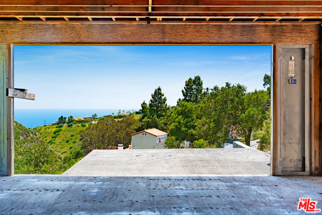 Active Building Permits! Malibu Architectural Design. Rare opportunity for Ocean View property with complete plans situated in tranquil lower Latigo Canyon. Partial build on a unique property with ocean, canyon and mountain views. Enjoy the captivating sunsets and beautiful ocean views from basically every room in your harmonious new home. Plans are an ocean-centric design characterized by clean lines, expansive glass, and a seamless integration with the natural landscape. Expansive rooftop deck adds an additional relaxing sanctuary to entertain and enjoy the spectacular outdoors. Water and Septic on the property. Power ready and street accessible. This property offers a compelling investment for those seeking to complete a bespoke architectural home in a serene Malibu setting. Create your oasis of peace and privacy. Easy access to hiking & biking trails and a minutes from sandy beaches.