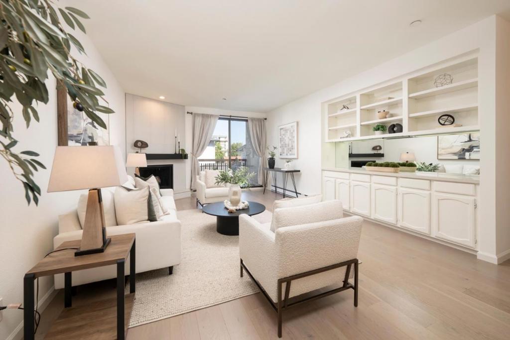 Say Hello to your new address! 2 Bed/2 Bath one-level unit (no stairs) in the heart of downtown! Embrace a walkable lifestyle with Central Park across the street and vibrant Downtown as your backyard, filled with shops/dining/fitness, and entertainment. DETAILS TO LOVE: Bright, modern kitchen shines with stainless steel appliances, crisp white cabinetry, quartz counters, and stylish tile backsplash. Generous storage and layout make it as functional as it is beautiful + curved archway adds charm and warmth, leading into the dining area. The living room feels instantly comforting with its charming archway, built-in shelving for books and little treasures with mirrored back that reflects natural light, and a cozy fireplace that anchors the space. Sliding doors extend the living outdoors to a covered balcony, perfect for unwinding year-round. Primary suite. In-unit laundry for convenience. BUILDING: Furnished rooftop deck w/BBQ and sweeping views, secure 2-car parking, storage, Seamless access w/ButterflyMX, trash chutes/elevator. Dues cover water/garbage. All commutes are simplified with Caltrain just blocks away, quick freeway access,10 min to SFO, proximity to leading employers. BONUS: Unit can be rented, giving you flexibility whether you are buying as a home or an investment.