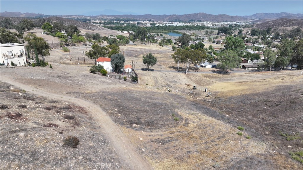 This 0.27-acre lot in Lake Elsinore, CA, provides a fantastic opportunity to build your custom home in a quiet suburban area. Located on a paved road with easy access, the lot is ideal for someone looking to build a getaway home, investment property, or first-time home. Lake Elsinore offers a blend of nature and convenience, with nearby parks, recreational opportunities, and local amenities. Whether you're looking for a peaceful retreat or an investment property in a growing community, this lot is the perfect choice.