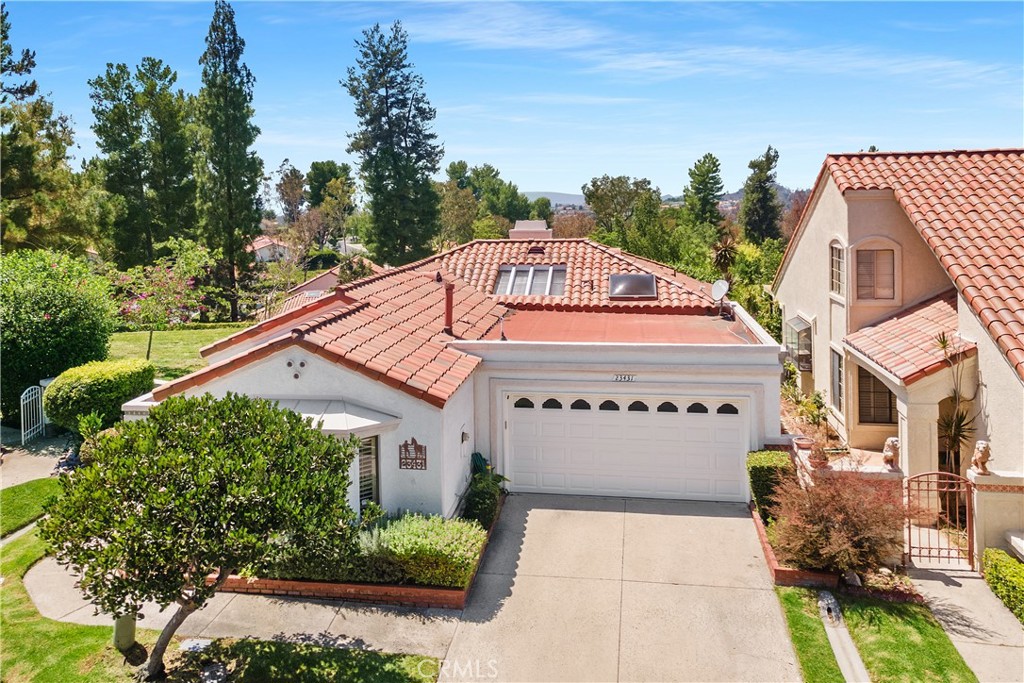PANORAMIC VIEW HOME JUST LISTED IN THE GATE-GUARDED SENIOR COMMUNITY OF CASTA DEL SOL! This single-level Pacific Grove model home sits at the end of a QUIET CUL-DE-SAC with 2 bedrooms, 2 bathrooms and nearly 1,500 sqft of interior living space. Features include WRAP-AROUND PATIO with off-street covered front entry, large formal dining room, living room with vaulted ceiling and gas/wood burning fireplace, and a bright & open kitchen with granite countertops, big garden window, wine fridge, and convenient breakfast bar. This Carmel series home benefits from tons of natural light, with a central atrium and added dining room window with permit. Enjoy PANORAMIC SUNSET VIEWS from all of the main living areas and the HUGE master bedroom, featuring vaulted ceiling, walk-in closet, and en-suite bath with dual-sink vanity, shower-in-tub, separate toilet room, and skylight. There is a second large bedroom at the front of the home with mirrored wardrobe doors and cathedral ceiling. Also includes a second full bathroom for guests, luxury vinyl & tile flooring throughout, updated baseboards, raised panel interior doors, and cooling fans in kitchen area & guest room. Out back is a large greenbelt to one-side and a FULL-LENGTH INSULATED VINYL PATIO COVER to enjoy the view. Direct-access 2-car garage also included with added storage and windowed roll-up garage door. All of this plus full access to all of the Casta del Sol community amenities, Mission Viejo Lake membership, no Mello Roos and a low 1.09% tax rate!