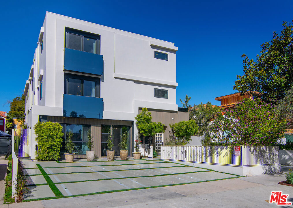 MODERN LUXURY TOWNHOME WITH A SEPARATE FURNISHED SUITE: Sophistically designed, these townhomes offer private entrances and the feel of single-family living, elevated by exceptional ceiling heights, delivering a layout that perfectly balances elegance and functionality. The main floor features an open-concept layout filled with natural light, a spacious dining and living area, and chef-inspired kosher kitchens outfitted to accommodate contemporary culinary needs, ideal for both daily living and sophisticated entertaining. The garage level has been transformed into a versatile, FURNISHED private JUNIOR SUITE that can serve as your home office or any other personalized living arrangement. Located in a prime walkable area near upscale retail, fine dining, and places of worship, this rare townhome building combines thoughtful design, upscale amenities, and an unbeatable location.
