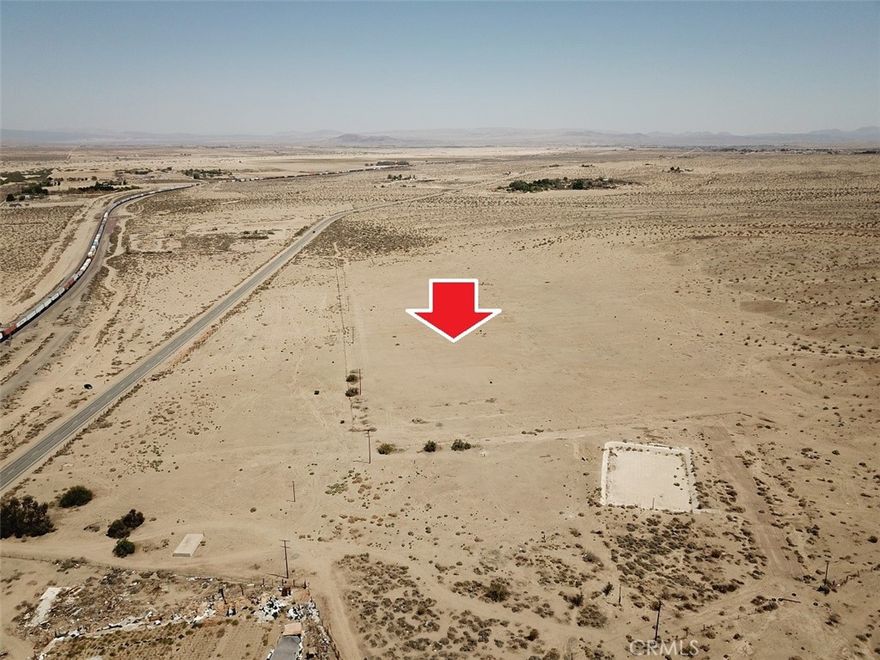 Huge 137 acres (2 parcels) fronting paved National Trail Hwy (Route 66), Barstow. APN #0421-051-11 & 08. Paved Road. Property has a well (unknown condition; buyer to verify) and a large concrete pond. Located SWC of National Trail Hwy and Buckboard Road. Level and rolling slope lot. Zoned Rural Living. NOTE: A major hub on the BNSF Southern Transcon in San Bernardino County where the Needles, Mojave and Cajon subdivisions come together, and the location of Barstow Yard, will be the site of Barstow International Gateway, a $1.5 billion investment described as a “state-of-the-art master-planned integrated rail facility, and the first being developed by a Class I railroad.