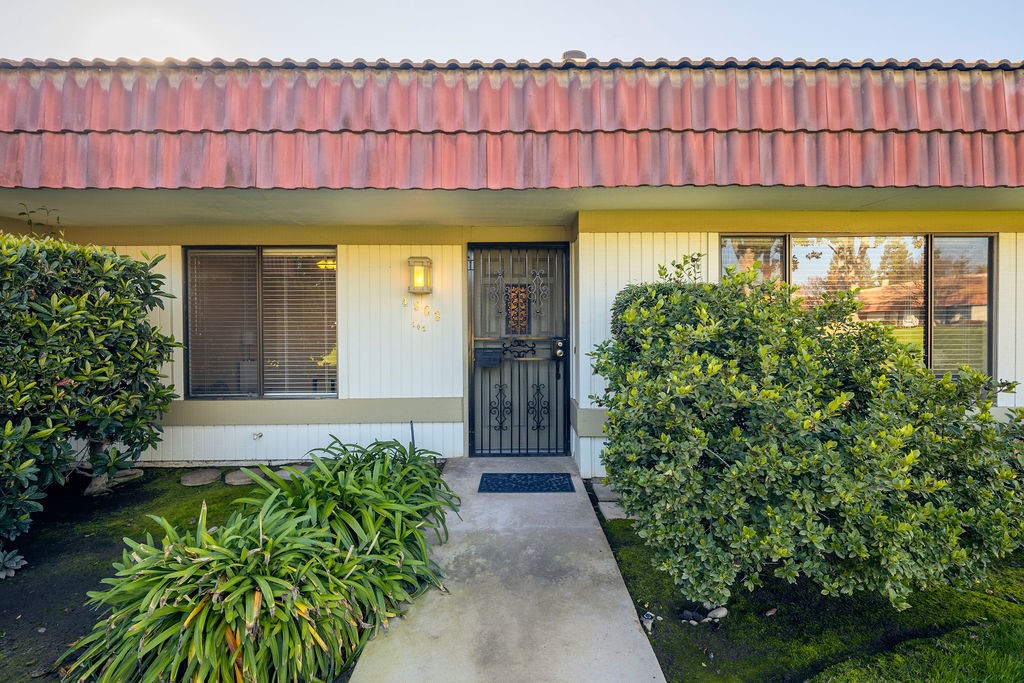 Welcome to your future home in lovely, gated, Windsor Gate. This charming home features two bedrooms and two bathrooms. As you enter, you'll note pride of ownership, tasteful updates and an open floorpan. The spacious living room, complete with dining area, is filled with natural light, a gas fireplace and beautiful wood built-ins. The kitchen features tastefully updated countertops and backsplash, an electric range and oven, built in microwave, dishwasher, kitchen island, an abundance of built in cabinetry and storage pantry allowing for ample storage. The utility/laundry closet completes this area of the home. With a grand primary bedroom, complete with en-suite bath and two walk-in closets, you'll retreat and relax in style. The large secondary bedroom also boasts its own walk in closet. The backyard space offers a covered patio between the home and the detached 2 car garage, multiple sitting areas and sweet garden spaces. This unique complex boasts well maintained grounds, with fruit trees scattered throughout, and a sparkling swimming pool, jacuzzi, and community room. Schedule your appointment to see this beautiful home today!