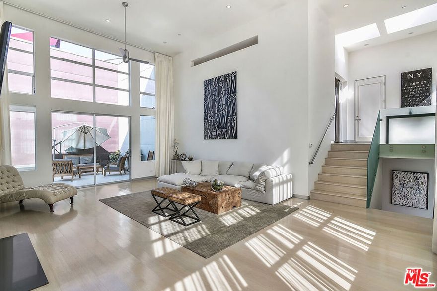 Stunning architectural unit in almost 2,500sf with loft-like features, soaring ceilings, tons of natural light and large windows. This beautiful property is the front unit of two homes on a lot and has lots of modern touches with sleek mix of stone and bamboo floors. The open Kitchen offers quartz counters, stainless steel appliances and custom cabinetry. The living room is flanked by a huge side patio and boasts huge windows and walls for art. The Master Suite is massive with spa-like bath, featuring a spa tub, separate shower and built out walk-in closet. A loft office, in unit laundry room and 3-car parking are just a few of the other details making this lease offering so special. Perfectly located in the heart of West Hollywood, it is just a few blocks from some of the city's best cafes, restaurants and retail stores.