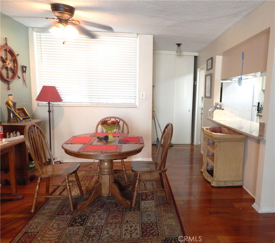 Popular Magnolia Palm Condo Complex. Assigned Underground Parking with an Extra Storage Room. The Unit is on the 2nd Floor in Building I which is Located off Arlington Ave, with Security Gate. Large Floor Plan with 1235 SQFT. Three Bedrooms & Two Baths. The 3rd Bedroom can be easily converted to a Large private Office or an Open Living Area. New Wood Flooring off Dinning & Hallway. Dual Pane Windows throughout. Kitchen has Granite Counter Top, Stove Top Oven, New Dishwasher, Newly Painted Cabinets, Central A/C, Newer Water Heater, New Refrigerator. Each Bedroom has Ceiling Fan & Lights. Spacious Outdoor Balcony & Its overlooking the Courtyard.