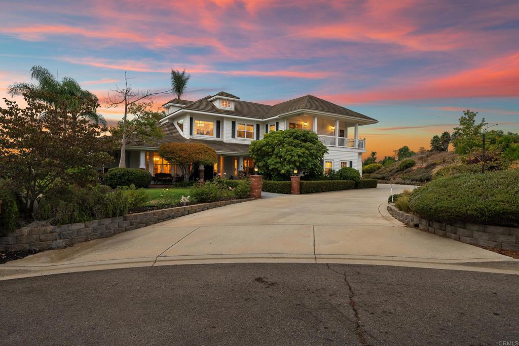 Discover a tranquil escape in the prestigious Stallion Hills, where timeless colonial architecture meets modern California living. Perched on a lush 1.03-corner acre estate with sweeping hillside views, this custom-built home offers front-row seats to endless sunrises and sunsets. Step inside and find 4 bedrooms + loft and 3.5 baths across 3,601sf of thoughtfully designed space. The primary suite on the main floor provides convenience and privacy, while upstairs bedrooms and a loft create flexibility for family, guests, or a creative retreat. At the heart of the home lies a gourmet chef’s kitchen - complete with a butler’s pantry, dual sinks and dishwashers, generous prep space ready to bring your culinary adventures and dinner parties to life plus a full size laundry room and views from every window. Outdoors, the property transforms into a private resort. Dive into the sparkling pool, unwind in the spa, or make memories as you gather around the built-in BBQ and fireplace. With room to host, room to roam, and even room for RVs or weekend toys, this estate is as versatile as it is enchanting. Equipped with water filtration system, electric vehicle charging station and fully owned solar. Perfectly located with easy access to Hwy 76, I-15, and I-5, you’ll enjoy both serene seclusion and convenient connection. This isn’t just a home - it’s a lifestyle where elegance meets play, and every day feels a little like vacation.