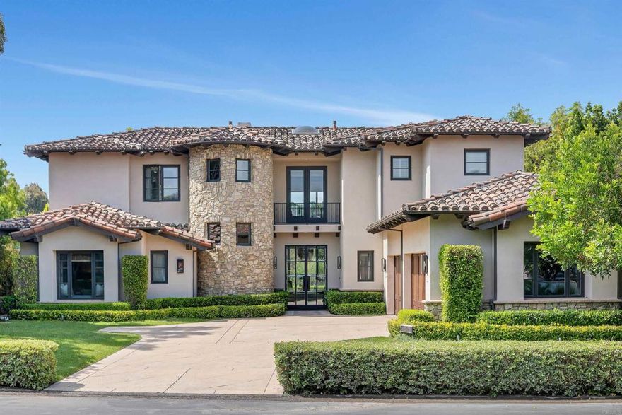 UNDER CONTRACT - Timeless Style - Modern Amenities - Premier Views: Perfectly positioned on one of the most sought-after view lots in the gated community of Meadows Del Mar, this custom 5,742 sq ft residence offers refined living with timeless transitional style. With rare southern exposure and unobstructed sweeping views across three different fairways of The Grand Del Mar golf course.  This home is filled with natural light and designed to inspire both quiet moments and grand entertaining. A masterclass in balance and symmetry, the home welcomes through custom metal and glass entry doors into a grand hallway, drawing the eye directly to an expansive view framed by soaring windows in the central formal living room—an architectural moment that instantly captivates. No detail has been overlooked. From the tailored downstairs office with clean-lined cabinetry to Phillip Jefferies wallpaper and exquisite tile selections in the kitchen and baths, each space has been thoughtfully curated with texture and interest. The main level features a serene primary suite, privately tucked away and complete with a generous lounge area—an ideal retreat for end-of-day reflection. Upstairs, three additional bedrooms each enjoy their own private balcony, offering space and privacy for family or guests. At the heart of the home, the spectacular kitchen with custom white oak cabinetry flows seamlessly into a warm and inviting family room with a custom fireplace, an intimate dining nook, and a motorized gesticulating TV arm—designed for both easy living and effortless hosting. Step outside to a lush, south-facing expansive, flat .42-acre golf course view lot—an uncommon find in the neighborhood. The backyard is a true haven, featuring a sparkling pool and spa, an outdoor kitchen shaded by a trellis, and a generous grassy area ideal for play and gathering. Completely remodeled and move-in ready, this home blends comfort, elegance, and exceptional craftsmanship to create a warm, welcoming retreat in one of North County’s premier communities