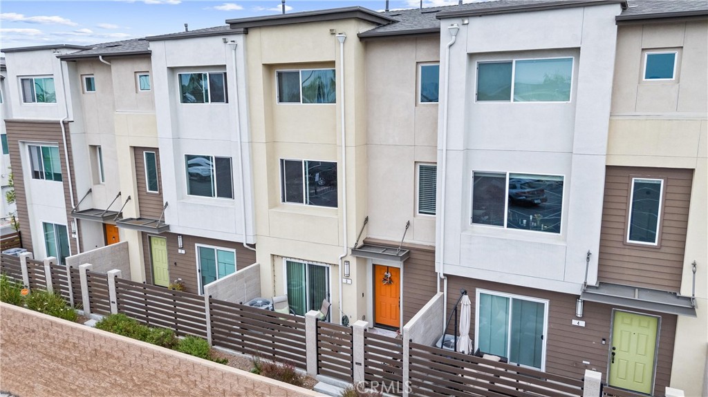 Welcome home to this beautifully maintained 3-bedroom, 3.5-bathroom townhome, built in 2021 and priced to sell! Tucked within the private gates of the highly desirable Stonefield community in Gardena, this three-story residence offers the perfect blend of style, comfort, and convenience. Step inside to find a thoughtfully designed layout for today's lifestyle. The entry level features a bedroom and bathroom with direct access to a private patio and an attached 2-car garage. Head upstairs to the heart of the home where you’ll find a bright and open living space ideal for gathering with family and friends. The gourmet kitchen is equipped with granite countertops, stainless steel appliances, a large peninsula island with seating, and a spacious walk-in pantry. The adjoining dining and living areas are flooded with natural light, creating a warm and inviting atmosphere for everyday living. Retreat to the top floor where you’ll find the tranquil primary suite with its own luxurious bathroom and walk-in closet, along with another spacious en-suite bedroom and a convenient laundry area. Additional highlights include stylish vinyl flooring throughout most of the home, central air and heat for year-round comfort, and thoughtful details that make daily life a breeze. Residents enjoy all the benefits of the Stonefield community, including a playground, dog park, ample guest parking, and secured gated entry. Commuting is a breeze with easy access to the I-110, I-91, I-405, and I-105 freeways, plus you’re just minutes from shopping, dining, South Bay beaches, SoFi Stadium, LAX, Downtown L.A., and more! Don’t miss this move-in ready gem—modern, well maintained, and truly priced to sell. Schedule your private tour today!