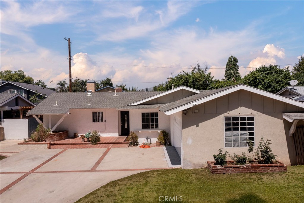 Welcome to this beautifully updated 4-bedroom, 2-bathroom home offering comfort, style, and functionality. Step inside to find an inviting layout with laminate flooring flowing throughout most of the home, creating a warm and cohesive feel. The nicely remodeled kitchen features modern finishes, ample cabinet space, and a layout that makes cooking and entertaining a breeze. Both bathrooms have also been tastefully updated with contemporary touches that enhance both form and function. The fourth bedroom is great for guests, or a home office. Outside, enjoy a great backyard perfect for entertaining, gardening, or relaxing in the sunshine. Whether you're hosting a weekend BBQ or letting the kids play, this outdoor space is ready for your personal touch. Ideally located near schools, parks, and shopping, this move-in-ready home checks all the boxes. Don’t miss your chance to make it yours!
