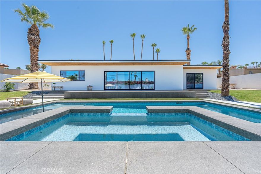 Welcome to South Palm Desert, where style meets comfort just minutes from El Paseo’s dining, shopping, and entertainment. This home has been completely reimagined with thoughtful upgrades inside and out, offering the perfect balance of modern convenience and resort-style living. Step inside to an open, airy layout with brand-new insulation, drywall, and polished concrete floors. The new kitchen is the heart of the home, designed with custom cabinetry and a spacious island, while new bathrooms feature sleek walk-in showers and fresh finishes. Expansive windows and entertainer’s sliding glass doors bring in natural light and open directly to the backyard, creating seamless indoor-outdoor living. Every major system has been replaced, including all-new plumbing, sewer line, dual 4-ton HVAC units, and a 400-amp underground electrical panel with upgraded power lines. Additional improvements include new windows, doors, insulation, and stucco, giving this home a fresh, contemporary feel throughout. Outside, the backyard has been transformed into a private retreat. Enjoy a brand-new saltwater pool and spa with app-based controls, an outdoor shower, new pool system, and professional landscaping with sprinkler and lighting systems. A Tesla charger, new concrete hardscape, and smooth stucco exterior add both function and style. Every detail of this home, from the upgraded systems to the private backyard oasis, has been thoughtfully designed to create a seamless blend of modern comfort and effortless desert living in one of Palm Desert’s most desirable neighborhoods.