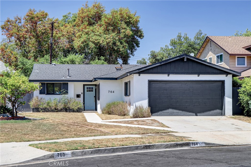 Don't let the lawn fool you - this is a turn key property that you're not going to want to miss! Great floorplan, perfect for entertaining. This home was fully remodeled in 2021. Open, light and bright and cheerful with a huge family room with cozy brick fireplace which opens to a dining room and gorgeous kitchen with custom cabinets, stainless steele appliances and Quartz countertops. There is a slider from the family room to the private backyard - perfect for entertaining All 3 bedrooms are nice size with ample closet space. Both baths are beautifully updated. Separate laundry room with Samsung washer and dryer included. 2 car attached garage. Located in a quiet cul-de-sac.