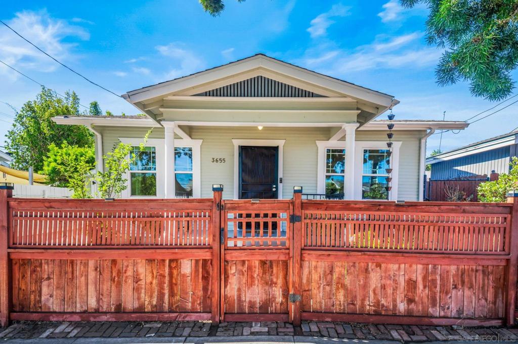 Built in 1924, this charming 2+ bedroom, 1-bath Craftsman blends timeless character with modern upgrades. In addition to the 624 sq. ft. main home, a versatile 119 sq. ft. bonus room offers extra space- bringing the total living area to approximately 743 sq. ft. Classic details include hardwood floors, a delightful vintage kitchen with a 1950s refrigerator and stove, and a bathroom featuring a clawfoot tub. Current owners replaced old knob and tube wiring, installed a tankless water heater, replaced plumbing, and completed recent foundation work. Central AC and an owned solar system keep electricity bills low. Enjoy the privacy of a fenced backyard, private garage, and driveway, all while being within easy walking distance to North Park’s vibrant shops, restaurants, and attractions.