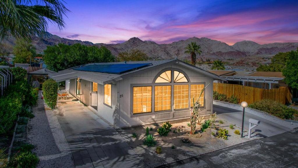 Welcome to the all age family community of Silver Spur where you'll enjoy many amenities such as a heated salt water pool, 2 hot tubs, a gym, putting green, bocce ball and a clubhouse for residents to use for birthday parties, meetings etc. Silver Spur is nestled at the bottom of the Santa Rosa Mountains on the Pines to Palms Highway just minutes from hiking trails such as Art Smith Trailhead and the Bump and Grind. Less than 5 minutes to El Paseo famous for high end shopping and restaurants. This 1986 manufactured home is low profile so no steps to climb to enter. Located in one of the best areas of the community with a large 60' x 83' lot with plenty of outdoor living space. Parking can accommodate 4-5 vehicles. A large barn style Shed World storage shed with plenty of room for your belongings. Landscape is watered by an automatic drip system. Inside features include 2 bedrooms, 2 bathrooms, laundry room, large living room and a family room with built in office area. Newer stainless steel appliances and a walk in pantry. Laminate wood look flooring in the living areas and carpet in the bedrooms. New AC and heater May 2022.Solar on the roof in and paid for, beutiful redwood fencing for your privacy. Call Marilyn Schwartz for showings Hurry this wont last long