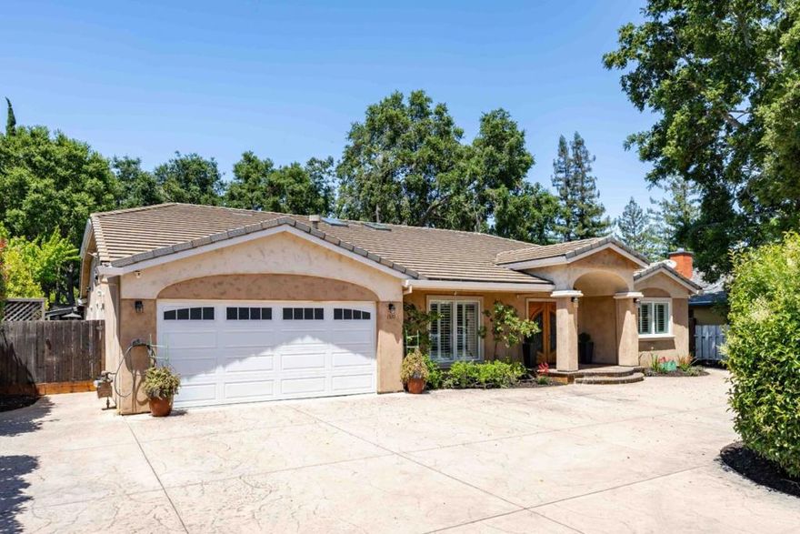 Nestled on nearly a third of an acre, this single-level home blends timeless elegance with everyday comfort in a sought-after neighborhood. Light-filled interiors showcase hardwood floors, millwork, and designer lighting, while an intuitive layout offers generous space for entertaining and daily living. Soaring ceilings crown the family room, which flows into an impressive chef's kitchen with top-tier appliances and abundant prep space. Formal living and dining rooms provide refined gathering areas, and five well-appointed bedrooms include a luxurious primary suite with direct access to the outdoors. The park-like backyard offers a peaceful retreat with a lush lawn, ample patio space, and a detached studio perfect for an office or gym. Enjoy a prime location within walking distance of scenic parks and the Rancho Shopping Center, just minutes from downtown Los Altos, the Los Altos Golf & Country Club, and Highway 85, and with top-ranked schools all located within approximately a mile.