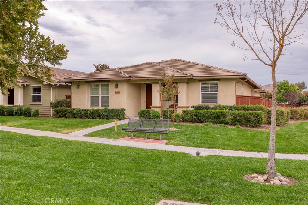 Located in the private, gated Traditions at River Oaks, a premier 55+ community, this inviting residence offers 2 bedrooms, 2 baths, a den that could easily be utilized as a 3rd bedroom, plus a versatile casita. Beyond the entry, French doors open to a cozy den/office, while the living room showcases a fireplace and expansive picture windows that fill the space with natural light. The open dining area connects seamlessly to the well-appointed kitchen, complete with a large center island, Corian counters, breakfast nook, built-in desk, and sliding glass doors leading to the back patio. The primary suite offers an en-suite bath and direct access to the spacious, low-maintenance backyard featuring pavers and a covered patio. A second bedroom, full hall bath, and laundry room with access to the attached 2-car garage provide everyday convenience. The detached casita, accessible from both the driveway and patio via French doors, adds flexibility for guests or hobbies. Just steps away, the community clubhouse offers resort-style amenities including a pool, spa, library, gym, meeting rooms, piano lounge, and an entertainer’s kitchen for larger gatherings. All this within minutes of downtown Paso Robles, with fine dining, boutique shopping, wine tasting, the farmer’s market, and year-round park events.