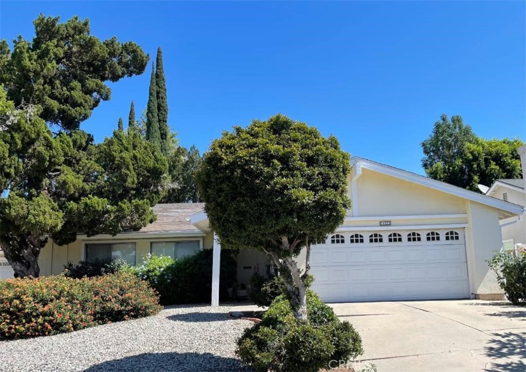 Beautiful home on quiet cul-de-sac in prime Northridge neighborhood. Good sized backyard with sunken garden, patio area and built-in barbecue make this an entertainer's delight. Open floorplan with large windows creates bright airy feeling. Vaulted ceilings. 2 car attached garage with direct access for convenience. Kitchen has granite tile counters and tile floors which are open to family room with fireplace. Living room has cozy fireplace with wood laminate flooring with a view of the backyard. Large primary bedroom with en suite bathroom. Close to shopping, entertainment and easy freeway access.