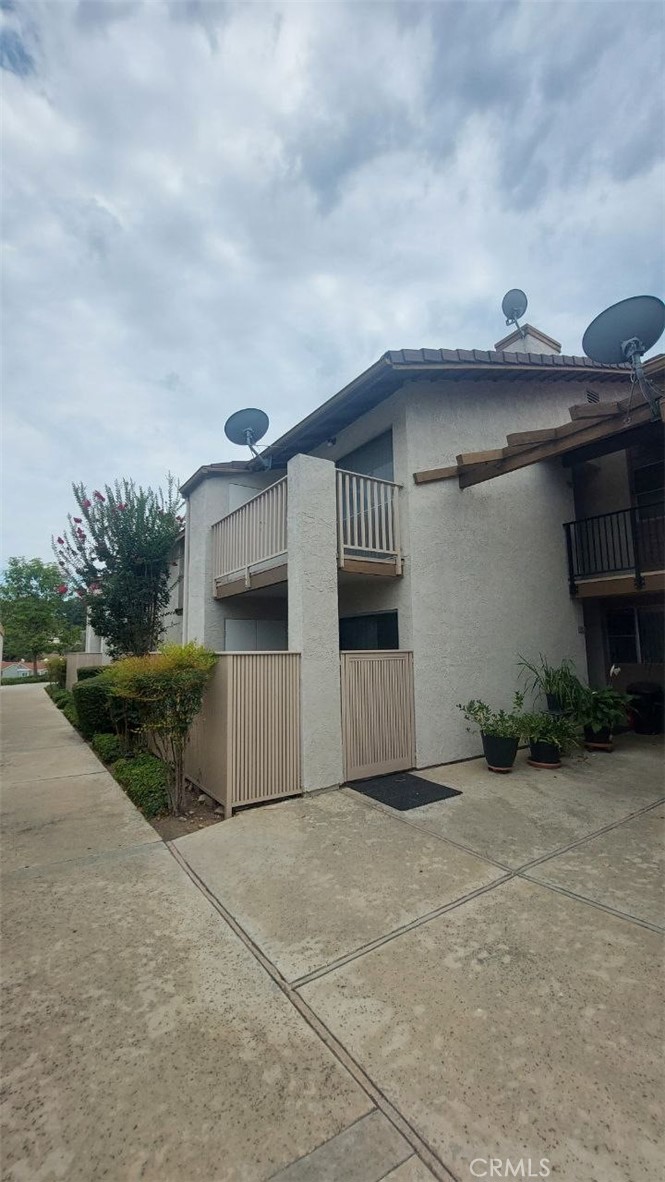 Nicely maintained home located in Los Angeles County with easy access to Orange, San Bernardino and Riverside counties. This unit offers a safe and secure gated community with a community pool, spa and picnic area with lush grounds fill with mature trees and shrubs. This move-in ready unit offers 2 spacious bedrooms, 1 has a large closet and the primary bedroom offers a walk-in closet, 1 car garage and 1 additional assigned parking space. Newer water heater and HVAC system, wet bar and plenty of cabinet space, cozy fireplace, laundry room, balcony and more.