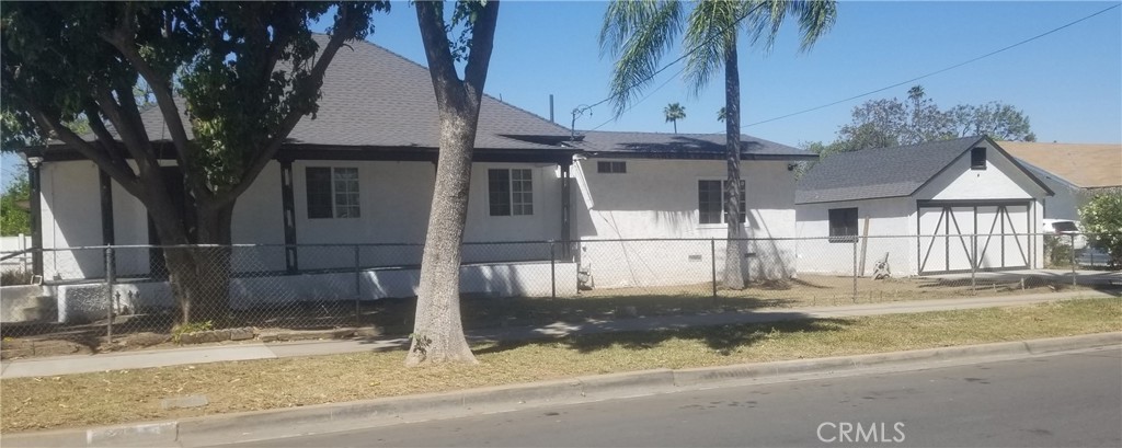 Welcome to a historic and large corner turnkey home, centrally located minutes from Downtown Riverside, the University of California Riverside (UCR), Riverside Community College (RCC), and the Iconic Mission Inn. This vintage one-story 3 bedroom and 2 bath gated home has a large corner lot with excellent curb appeal. Many renovations bring the best of this house's past and present. It includes new paint interior & exterior, an entirely remodeled kitchen with a walk-in pantry, and recessed lighting. The entire home has been completely renovated with tile, updated windows, and a central A/C. The exterior area presents a new patio backyard, reconstructed porch, a newly installed asphalt driveway, and foundation. The home's roof has been replaced to last for many years to come. The detached garage and storage shed holds great rental earnings potential as an investment opportunity. It can be converted to a secondary residential Accessory Dwelling Unit (ADU) ie. studio. This traditional home's key features with its large lot and easy access to major freeways, the Metrolink, schools, shops, dining, and more creates a perfect space for multigenerational living.