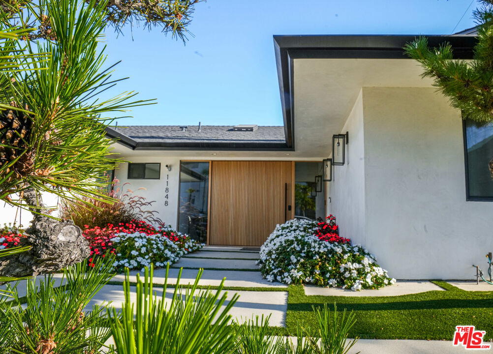 Stunning Custom-built 4-bedroom, 4-bathroom fully remodeled House with spacious & high-ceiling living room. Situated across the Getty Center, this property is just minutes away from prime Brentwood's finest restaurants and eateries, Westwood Village, the sun-soaked beaches and boutiques of Santa Monica, UCLA, golf courses, and freeways. The home features no stairs to enter the house or within, offering convenience for individuals with mobility difficulties.