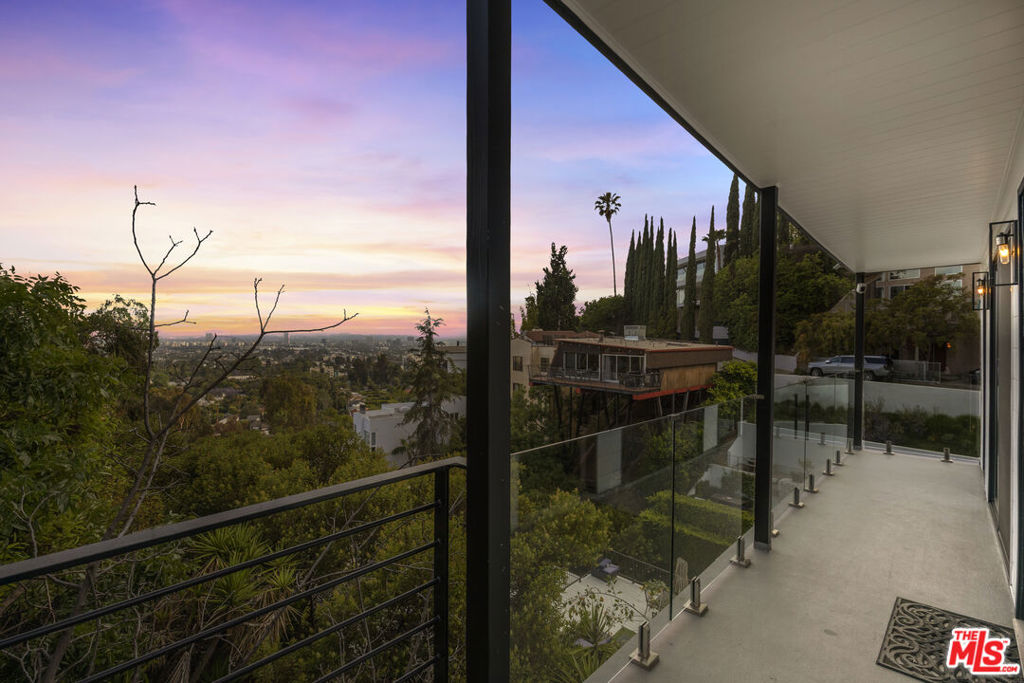 Perched above the city in an ultra-private enclave, 1788 & 1790 N Orange Grove offer a rare opportunity to own two beautifully detached, renovated townhomes in one of LA's most iconic neighborhoods. Boasting approximately 1,692 Sq Ft a 4 bed /4 bath and 1,037 Sq Ft a 3bed/2 bath , each residence blends contemporary sophistication with sweeping vistas of the Hollywood Hills. Designed with a keen eye for luxury and comfort, both homes feature expansive open floor plans bathed in natural light, high-end finishes throughout, and chef-caliber kitchens equipped with premium Viking stainless steel appliances. Enjoy the ease of in-unit laundry, thoughtful layout, and a sense of separation and independence rarely found in duplex living. Whether you're seeking a refined personal residence, a stylish pied--terre, or a strong-performing long or short-term investment, this property delivers. Surrounded by tranquility yet minutes from the energy of Sunset Strip and West Hollywood, it's the best of both worlds scenic hillside living with urban convenience.