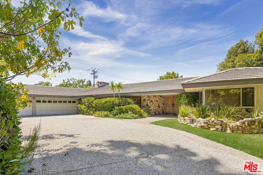 Welcome to 1805 Lexington Road one of the most prestigious addresses in the world. Originally purchased in the 1950s, this timeless single-story Mid-Century residence was well ahead of its time. Set on nearly half an acre, the home spans over 5,000 square feet of living space and captures both comfort and sophistication in the heart of Beverly Hills, just steps from the world-famous Beverly Hills Hotel. Notable history adds to its allure, with legendary actress Lucille Ball once living just next door. The interiors feature 5 spacious bedrooms and 7 baths, including a primary suite with a huge walk-in closet. A chef's kitchen, complete with a pizza oven, serves as the heart of the home and opens to multiple entertaining spaces. Designed for hosting, the residence also includes a custom built-in bar in the formal living room and a second bar in the den that flows seamlessly to the backyard. Additional highlights include staff quarters, a 3-car garage, and a motor court with ample parking for multiple vehicles. The private backyard is anchored by a sparkling pool at its center, creating a resort-like atmosphere ideal for both intimate gatherings and large-scale entertaining. Whether restored to its Mid-Century glory or envisioned as a brand-new estate, 1805 Lexington offers a once-in-a-lifetime opportunity to craft a world-class residence on one of Beverly Hills' most iconic streets.