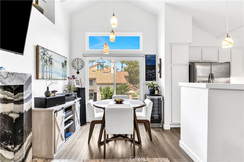 Located in the desirable Palm Court community of Laguna Niguel—right next to scenic Chapparosa Park—this highly upgraded 1-bedroom condo offers comfort, style, and convenience. With no one above or below, enjoy the privacy plus a direct-access garage.
The light-filled interior features vaulted ceilings, newer dual-pane windows, and dual-option window treatments for nighttime and daytime coverage. Vinyl plank flooring runs throughout home, including stairs with white risers that invite you to the living space. The kitchen and bathroom have been tastefully updated with sleek quartz countertops. Bathroom features a modern textured tiled shower + bath, with a fog-less in-shower mirror. A striking marble-surrounds the electric fireplace - which complements the stone shelf in the living room and in the foyer. Two new sliding doors lead to outdoor spaces, including a spacious balcony ideal for dining, grilling, or soaking in the sun. This home checks all the boxes for full-time living or a weekend getaway, all within a resort-style community offering pool, spa, tennis and pickleball courts, and unbeatable proximity to trails, beaches, shops, and restaurants - with Dana Point Harbor and Salt Creek Beach being just a couple of miles away. Don't miss your chance to own this turnkey gem in the heart of South Orange County! Updates in recent few years include: New HVAC and Ductwork, new Water Heater, new Washer & Dryer (vents cleaned), new Garage Door Opener plus the previously mentioned new windows, including sliding doors, electric fireplace, and stone counters. INVESTORS - Same community rental comps for 1-bedroom are around $2,900/month.
