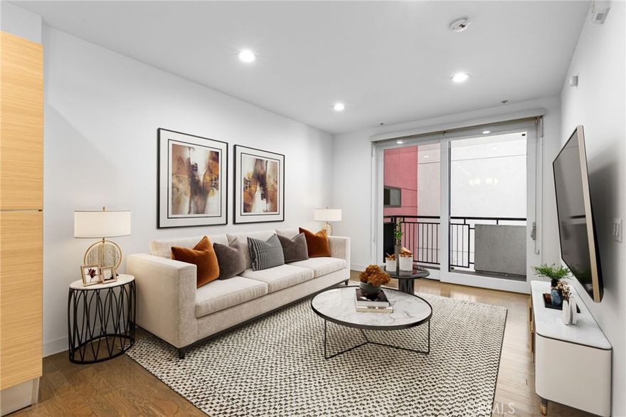 Don’t miss this end-unit opportunity in the prestigious Vero community that offers modern elegance, luxurious amenities and captivating views of the cityscape. Boasting an open-concept floor plan, the unit is flooded with natural light from large windows and features stunning hardwood floors throughout. The thoughtfully designed interior includes a spacious kitchen with European-style cabinetry, sleek stainless-steel appliances, brand new carpet and a generous living area that seamlessly flows into a private balcony, ideal for relaxation or hosting guests. The bedroom is a cozy retreat with a charming vanity area, and a double closet with custom hardwood organizers. The convenience of an in-unit washer and dryer adds to the practicality of this stylish space. This end-unit has no neighbor on one side and also includes two dedicated parking spots. The Vero community provides a resort-style living experience with an impressive array of amenities. Stay active in the state-of-the-art fitness center, relax in the heated pool or spa, unwind in the sauna, or practice yoga in the dedicated studio space. Additional amenities include a library, concierge services, and 24-hour security. Located in the dynamic Westlake neighborhood, this home is just a short distance from shopping, dining, and entertainment options. It’s only minutes from LA Live, Financial District, USC, and major freeways. Don’t miss the opportunity to live in this exquisite, centrally located home—where luxury, convenience, and style come together in the heart of Downtown LA.