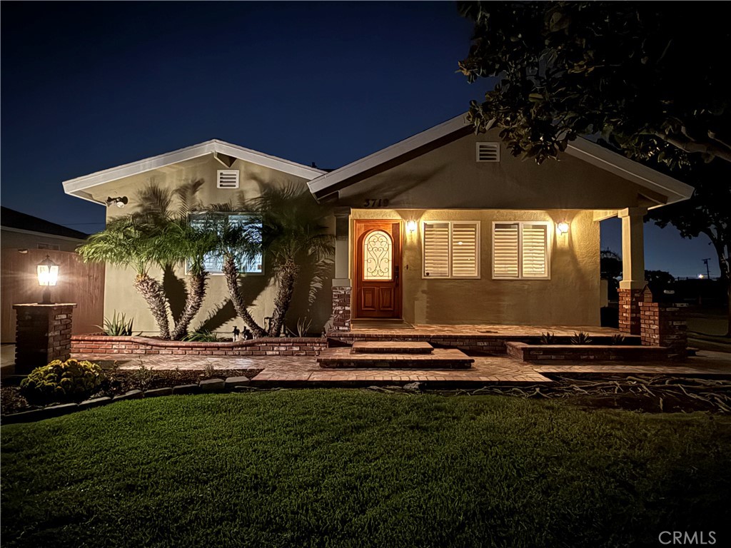 Charming, curb appeal, single-story residence perfectly situated on a desirable corner lot. This home combines timeless essences with thoughtful layouts, creating a warm and inviting space both inside and out. From the moment you arrive, the curb appeal shines with a lush green lawn, mature shade tree, and an elegant brick-accented walkway leading to the covered front porch. The freshly landscaped flower beds and decorative exterior lighting add to the inviting ambiance. Step inside to discover a bright and airy layout featuring large dual-pane windows with custom plantation shutters, wood flooring that fill the home with natural light while providing privacy. The spacious living areas are perfect for both relaxation and entertaining. The open floor plan flows seamlessly, with vaulted ceilings, well designed recessed lights and abundant natural light enhancing the airy ambiance. This home offers 3 well-appointed bedrooms adorned with calming neutral tones, plush carpeting, and designer finishes. Each room is a serene retreat, complete with ample closet space. The two spa-inspired bathrooms are elegantly designed with granite countertops, dual vanities, and soaking tubs, complemented by sleek glass-enclosed showers, providing both elegance and functionality. Outside, enjoy a private patio retreat with ample room for gatherings, gardening, or simply unwinding under the California sun. A wide gated driveway and detached 2-car garage provide plenty of parking spaces. Additionally, this property features a bonus workshop of approximately 200 sqft - permitted, offering additional space for creative projects, hobbies, or extra storage. Conveniently located near parks, schools, shopping, and major freeways, this home is ideal for families and commuters alike. Don’t miss your chance to own this exquisite home. Contact us today for a private viewing!
