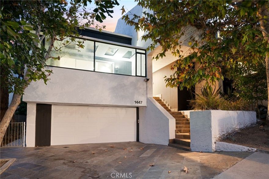 Now available for lease, this stunning 4-bedroom, 4-bath contemporary mansion is nestled in the prestigious West Hollywood Hills on a sprawling 28,008 sq. ft. lot, offering the perfect blend of architectural elegance and upscale comfort. Designed for luxurious living and seamless entertaining, the home features soaring 26-foot vaulted ceilings and floor-to-ceiling windows that flood the interiors with natural light. A sleek modern kitchen connects effortlessly to the family room and game room with a pool table, leading out to a spectacular Jay Griffith-designed backyard with a pool, BBQ area, and panoramic city views. The top-floor primary suite is a true retreat with a fireplace, walk-in closet, spa-like bathroom, sauna, and private patio, while a lower-level suite with separate entrance is ideal for guests or a home office. Additional highlights include a library, owned solar panels, four-car parking, and shared access to a tennis court—all just steps from the iconic Sunset Strip. This exceptional home is available furnished or unfurnished to suit your lifestyle.