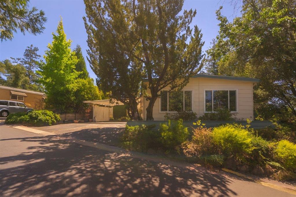 Welcome to 552 Bean Creek Road, Unit 37, a beautifully updated mobile home offering modern comfort in the highly sought-after Montevalle (55+) community. This charming two-bedroom, two-bathroom residence boasts views of a serene lake and lush greenery. Step inside to find a home bathed in natural light, accentuating the refreshed interior. The updated kitchen features sleek quartz countertops and ample space for culinary creativity. Both bedrooms provide comfortable retreats, complemented by two well-appointed bathrooms. A serene deck offers a sun and shade from surrounding trees. Beyond the inviting interiors, Montevalle offers an unparalleled lifestyle with a wealth of amenities designed to cater to every interest. Immerse yourself in relaxation at the community's two sparkling pools, unwind in the soothing hot tub or sauna, or challenge friends to a game on the putting green or outdoor shuffleboard court. For those with a creative spirit, the on-site pottery room offers a unique space to explore your artistic side. The community's many offerings, include a clubhouse, recreation room, and organized activities. Surrounded by mature trees and scenic vistas, this property provides a peaceful escape while remaining conveniently located near local shops, dining, and services.