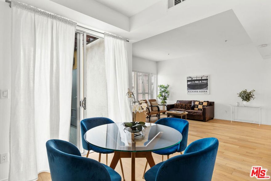 Top-Floor Corner Penthouse | Pool & Private Balcony. Experience elevated living in this remodeled, light-filled penthouse  a rare corner unit with no one above you. Soaring ceilings, wide-plank wood floors, and walls of windows create a bright, open atmosphere that flows seamlessly to your private balcony. The chef-inspired kitchen has been fully updated with modern finishes and stainless-steel appliances, while the updated bath offers a serene retreat. Enjoy the privacy of a quiet top floor, along with two secure parking spaces. Residents also have access to a sparkling pool and gated entry, all in an unbeatable Studio City location moments from Ventura Blvd.'s shopping, dining, and nightlife.