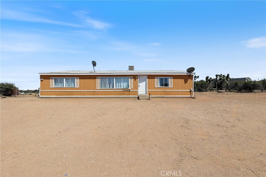Peaceful Oak Hills Retreat on 2.25 Acres with Sweeping Views and Permanent Foundation!

Welcome to 8195 Alta Mesa Rd, a serene country escape nestled in one of Oak Hills’ most desirable neighborhoods. This 3-bedroom, 2-bath manufactured home, built in 2002 and set on a permanent foundation, offers the perfect blend of rural charm and modern functionality on a spacious ±2.25-acre lot.



Step inside to discover 1,512 square feet of bright and comfortable living space, featuring an open-concept layout that’s ideal for relaxing evenings or hosting guests. Whether you’re enjoying the warmth of a cozy evening indoors or stepping outside to take in panoramic desert and mountain views, this home invites you to unwind and embrace the high desert lifestyle.



The expansive lot provides plenty of room for horses, RVs, off-road toys, or future additions like a workshop, garage, or even an ADU. With ample space for gardens, animals, and outdoor entertaining, the possibilities here are endless. This fully usable lot is a rare find, offering privacy, potential, and peaceful living just minutes from schools, shopping, and freeway access.



Enjoy the best of both worlds—a quiet, spacious retreat without sacrificing proximity to the I-15 and Hwy 138 for commuters. Whether you’re looking to settle down, invest, or escape the hustle of city life, this Oak Hills gem is ready to welcome you home.



All information deemed reliable but not guaranteed. Buyer to verify all.