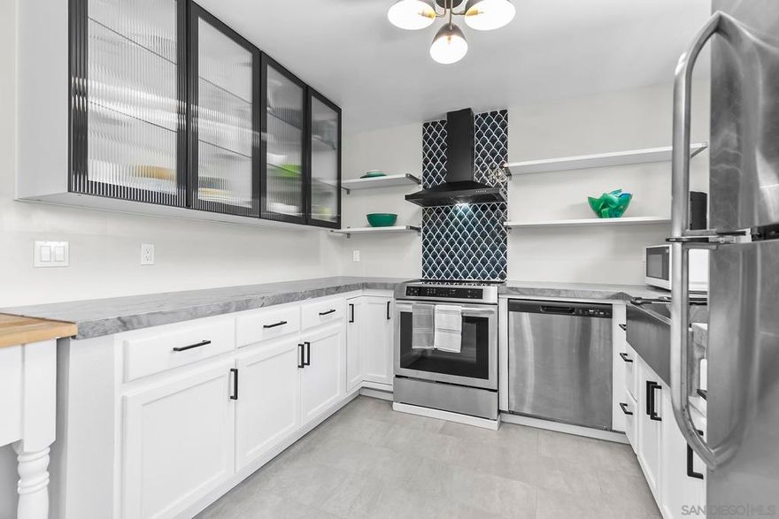 This home offers sweeping Views and stunning sunsets. Perched in one of the neighborhood’s best locations in Bay Park A designer renovation features an open-concept floor plan that seamlessly connects the oversized living room, dining, and kitchen.  New upper cabinets with open shelving natural quartzite countertops, Induction cooktop/range, striking 32-inch hammered stainless steel sink. Freestanding peninsula island — perfect for casual dining.  Fresh, Modern & Ready for You in Bay Park!  Freshly painted, luxury vinyl tile flooring, a custom-built fireplace, and a beautifully tiled walk-in shower. With 864 sq. ft. plus an enclosed patio (total approx. 924 sq. ft.), this home blends style, comfort, and convenience. Just minutes from Mission Bay, local restaurants, shopping, the I-5 freeway, and the San Diego Trolley line with direct service to UCSD and downtown.  Fresh, Modern & Ready for You in Bay Park! Move right in and enjoy a bright open floor plan, quartzite counters, induction cooktop, and beautifully tiled walk-in shower.  Close to shopping, and coastal adventures. With 864 sq. ft. plus an enclosed patio (total approx. 924 sq. ft.), this home blends style, comfort, and convenience. Enjoy Bay views and night lights from your extended enclosed patio and bedroom. You will love the comfort of this home.