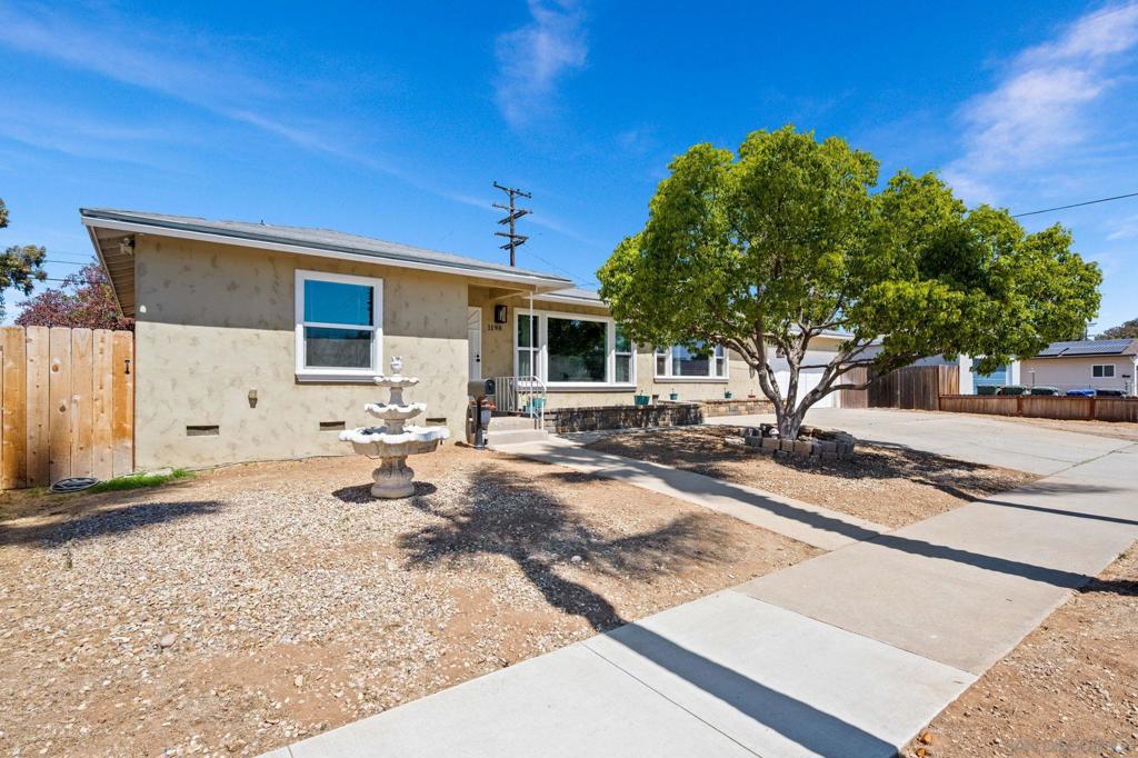 Beautifully updated 3BD/2BA single-level home w/oversized 2-car garage. Expansive living room opens seamlessly to dining and kitchen with quartz counters, pantry, & stainless appliances. Spacious primary suite features walk-in closet & en suite bath with tiled shower. Enjoy a huge backyard with pool, dog run, and large patio. Custom cabinets in garage with ample storage. Recently upgraded stucco and windows plus central AC make this home move-in ready. A perfect blend of comfort, style, & function awaits!