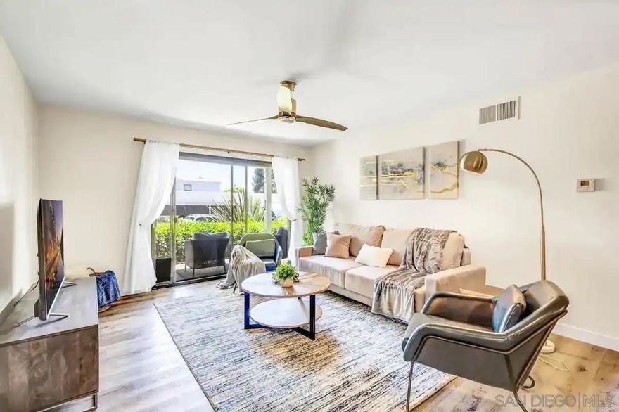 This fully furnished property is available for mid and long-term stays. Rates are subject to change based on seasonality and length of stay. Nestled in the heart of Carmel Valley, this charming ground-floor condo is your gateway to San Diego’s coastal beauty and vibrant lifestyle. With two bedrooms, two bathrooms, resort-like amenities, and a pet-friendly policy, it’s the perfect spot for families, friends, or professionals seeking a peaceful yet convenient retreat. Just a short drive to Torrey Pines State Beach as well as multiple shopping centers, you'll find stunning hiking trails, water activities and a fantastic selection of dining and shopping options nearby. Inside, the living room invites relaxation with a comfy couch, a flat-screen TV, and sliding doors that lead to a quaint front patio with seating for two. The adjacent dining area features a table for four, perfect for shared meals or game nights. A light-filled, modern kitchen boasts stainless steel appliances and is fully equipped to meet all your culinary needs. Bedroom 1 offers a king bed, dedicated workspace and a flat-screen TV, while bedroom 2 includes a queen bed, desk, and chair, ensuring comfort and productivity for all guests. A bonus queen pull-out couch in the living room accommodates two additional sleepers. One bathroom features a convenient combo shower/tub and the other has a sleek shower. Additional perks include mini split systems for heat, A/C, and dehumidifier in the living room and all bedrooms, quiet high-speed internet, in-unit laundry, and a designated carport parking spot. Surrounded by serene greenery, koi ponds, and sparkling lakes, the community offers an array of amenities, including a tennis court, pool, spa, BBQ area, and clubhouse. Whether you're here to unwind, explore, or work remotely, this condo is the perfect home base for your San Diego adventure. This fully furnished property is available for short-, mid-, and long-term rentals. Rates are subject to change based on seasonality and length of stay. Contact listing agent for specific rates tailored to your preferred stay length and timing.