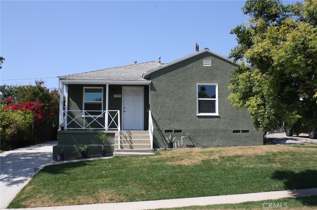 This adorable three bedroom, one bath home with a detached two car garage has been recently renovated. The cozy, light filled living room/dining room greets you as you enter. Newer gray toned, luxury vinyl plank flooring and fresh white paint throughout make this home light and airy. Step into your gorgeous kitchen with quartz countertops, white cabinets, stainless steel sink, stainless steel double ovens, a 5 burner cooktop and wine refrigerator. An extra cabinet and counter space adds more room to cook and prep. There is plenty of storage and a good sized pantry. The bathroom has been recently re-done with fresh white tile, sparkling tub, sink, toilet and medicine cabinet. This house is equipped and ready for electrical vehicle (EV) charging. There is a good sized private back yard to relax and unwind. New double pane windows all throughout the home, fresh landscaping in front and back, sprinkler system on timers, new concrete driveway and a detached two car garage complete the picture of this lovely home.