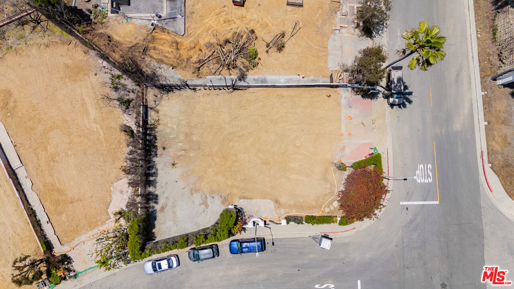 Best value in the Highlands. Incredible opportunity to build your dream home on a prime corner lot in the highly desirable Highlands neighborhood of Pacific Palisades. Priced at just $161 per foot, this property offers exceptional value in a premier Westside location. Located within the Summit community which was largely untouched, residents enjoy access to exclusive amenities at the Summit Club, including tennis and pickleball courts, a fitness center, large heated swimming pool, spa, playground, basketball court, and a dedicated dog park. This serene neighborhood also benefits from a 24-hour security patrol. The lot previously housed a 3,622-square-foot residence, which may allow for an expedited rebuilding process of up to 3,984 sq ft. Both Phase 1 and Phase 2 debris removal have been completed, streamlining the path to redevelopment. Set on a quiet street, this lot is just minutes from Palisades Village, acclaimed public and private schools, beach access, and some of the area's best hiking trails. Whether you are envisioning a personal retreat or an investment, this property offers the perfect opportunity in one of LA's most desirable coastal communities.