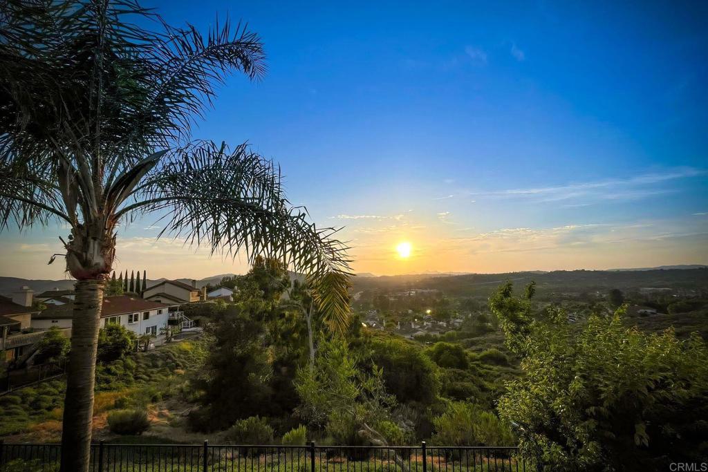 Priced to sell-PEACEFUL HILLSIDE RETREAT with INCREDIBLE VIEWS!! Welcome to the highly desirable Sonata community in South Escondido, tucked away on a quiet cul-de-sac overlooking the scenic San Pasqual Valley. This beautifully renovated home blends timeless charm with thoughtful modern upgrades, all while showcasing sweeping west-facing views. Designed for today’s lifestyle, the floor plan offers exceptional flexibility for guests, remote work, or multi-generational living. Recent updates include new flooring, fresh interior paint, energy-efficient windows and sliding doors, and a skylight that bathes the entry in natural light. Inviting Main Level Step through custom double doors into soaring vaulted ceilings and an airy living space filled with light and views. The open living and dining areas flow seamlessly into a custom kitchen, casual dining nook, and family room, all with multiple access points to the expansive Trex balcony and backyard. A private guest bedroom with a bay window and full bath completes the entry level. Private Lower Level Retreat: Downstairs, every bedroom enjoys stunning views. The primary suite features a walk-in closet and brand-new sliding doors opening directly to the backyard. Two additional bedrooms (one with backyard access), a full bath, and ample storage create the perfect balance of comfort and convenience. Minutes from Westfield Mall, Kit Carson Park, The Vineyard Golf Course, Safari Park, local wineries, and top dining, this hillside retreat offers the best of both tranquility and accessibility. Discover this rare gem that combines space, style, and modern convenience in one of Escondido’s most sought-after hillside communities.